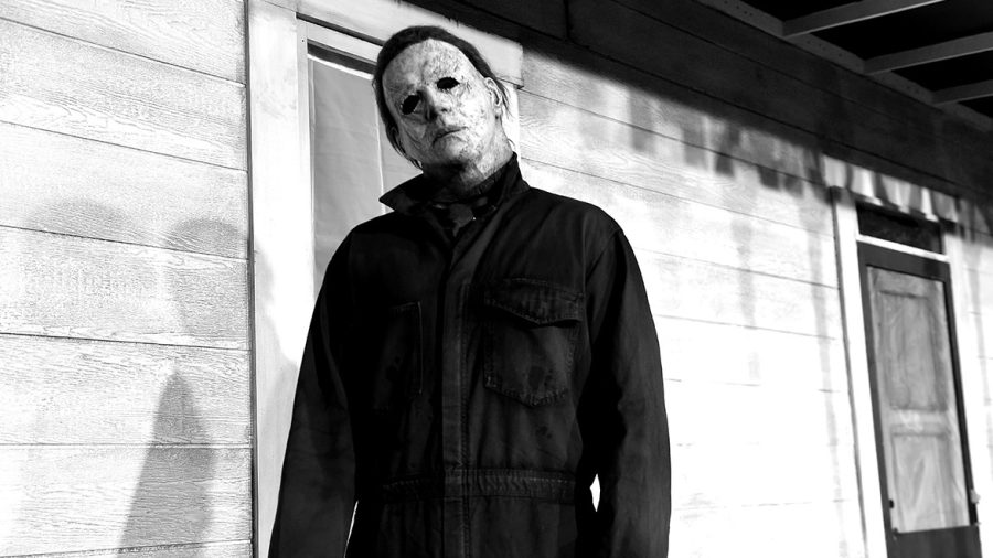 HOLLYWOOD, CALIFORNIA - OCTOBER 17:  (EDITORS NOTE: Image has been converted to black and white. Color version is available.)  An actor dressed as the character of Michael Myers attends the Universal Pictures Halloween premiere at TCL Chinese Theatre on October 17, 2018 in Hollywood, California. (Photo by Kevin Winter/Getty Images)